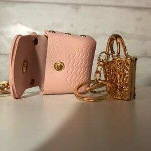 Group of four keychains or/and purse charms.